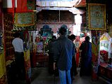 36 Inside Old Chiu Gompa My guide and driver mingle among the pilgrims in the old Chiu Gompa.